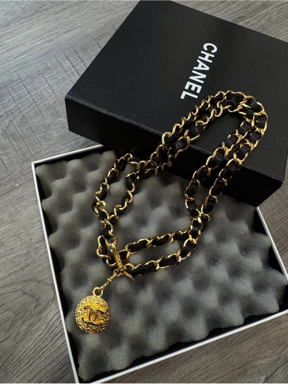 CHANEL Black and Gold Leather-Woven Chain Necklace with Logo Medallion